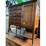 An Edwardian mahogany music cabinet.