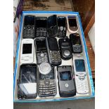 A tray of mobile phones.