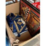 A box containing masonic regalia and pictures.