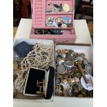 A collection of costume jewellery, military buttons and badges.