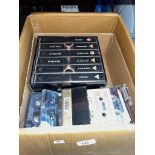 Various Star Trek video cassettes and a box of music cassettes