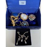 A blue Jewellery box containing Ruskin brooch, antique cameo brooch, Scottish brooch etc