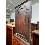 An oak corner cabinet.