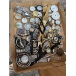 A tray of mens and ladies watches, a few pocket watch movements, some Swiss made.