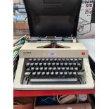 A Olympia Monica S portable cased typewriter