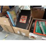 3 boxes of boxed games to include Wasgij? Monopoly, Backgammon, etc and a group of pictures