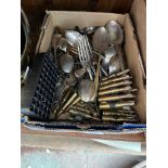 A box of silver plated items, cutlery, salts etc and some brass bullet casings.