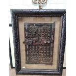 A carved African Dogon (Mali) granary door, approx. 47cm x 67cm, framed and glazed,