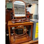 A 19th century mahogany toilet mirror and a swing mirror.