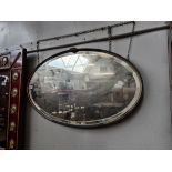 An early 20th century metal framed mirror, width 70cm.