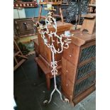 A wrought metal candle stand, height 156cm.