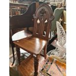 A Victorian Gothic Revival oak hall chair.