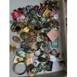 A box of badges, thimbles, etc.