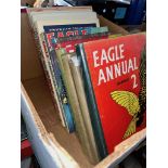 A box of Eagle and Beano annuals.