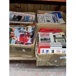 Three boxes of football programmes and World cup commemorative covers.