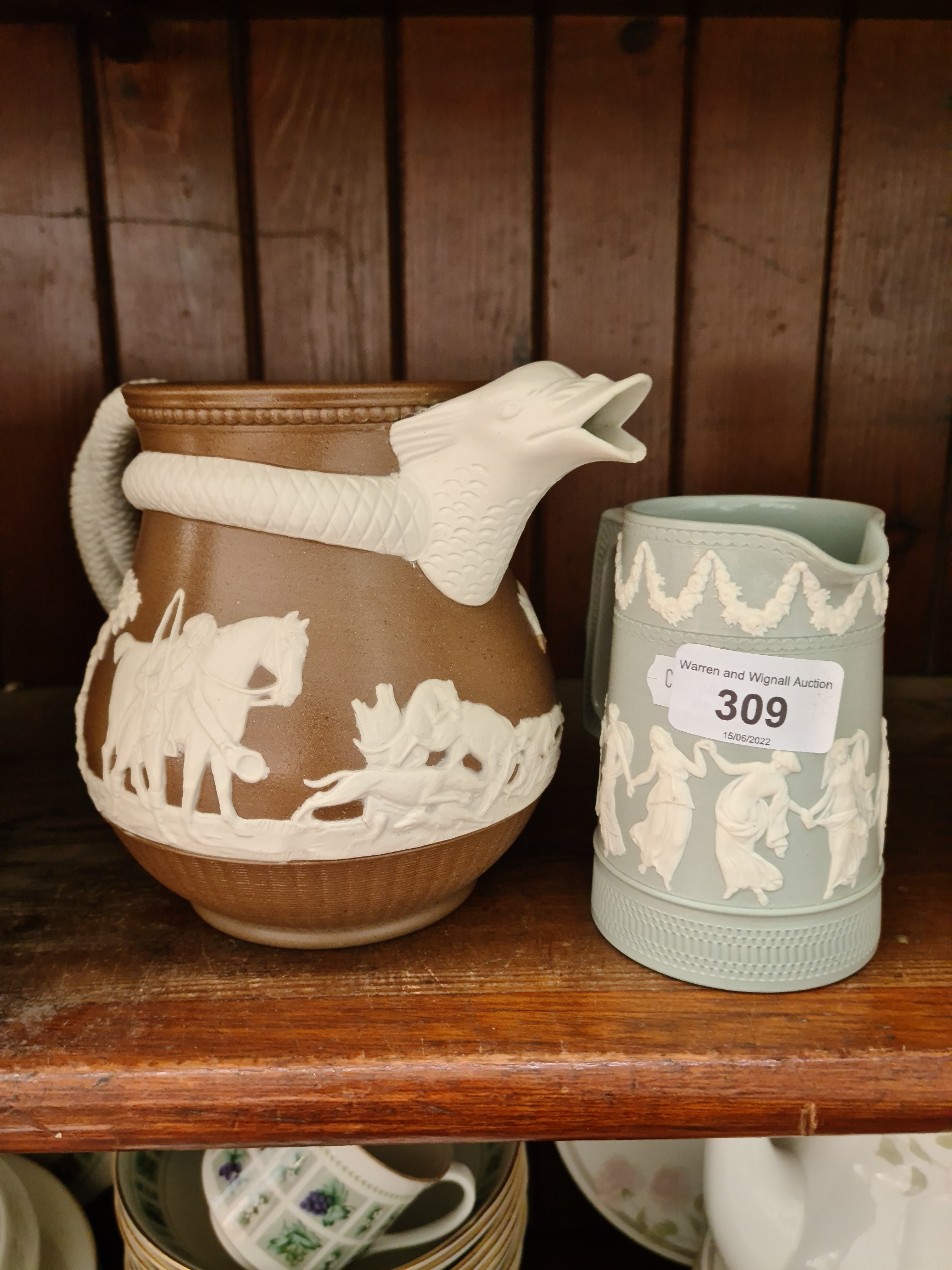 Antique Staffordshire caneware jug together with a Copeland jasper style jug, both 19th century