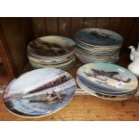 A box of Royal Doulton, Wedgwood and Davenport collectors plates, railway and aircraft.