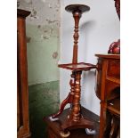 A 19th century tray top pedestal table and a torchere plant stand.