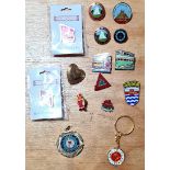 A group of pin badges/keyring/medal to include camping and caravanning club & trams and Eddie