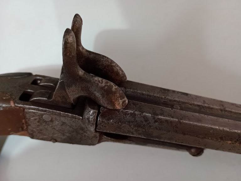 An antique double barrelled pistol with drop down triggers. - Image 4 of 6