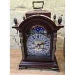 A reproduction mahogany cased clock with brass dial, made by Schatz Rombach Ltd, Holland.