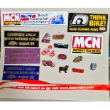 A group of motorcycle pin badges, 3 Woodvale international rally plates and some motorcycle