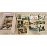 A large collection of various antique and vintage postcards.