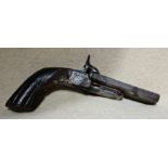 An antique double barrelled pistol with drop down triggers.