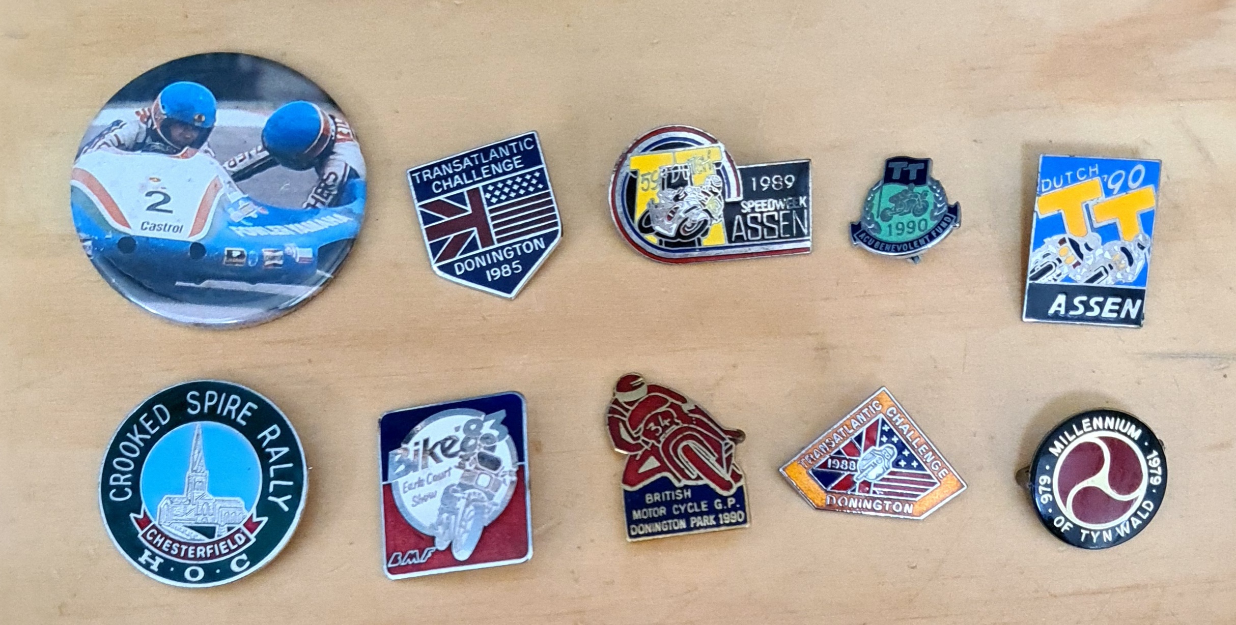 A group of 10 motorcycle pin badges