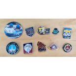 A group of 10 motorcycle pin badges
