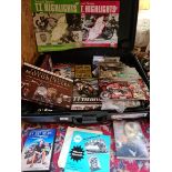 A collection of motorcycling memorabilia including LPs. DVDs, magazines, etc.