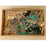 A collection of costume jewellery to include brooches, necklaces, malachite necklace, earrings,