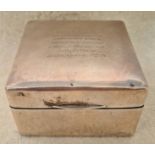 A silver bound cigarette box with engraved message and dated 1927 - 1928. Marks rubbed