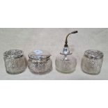4 silver topped jars.