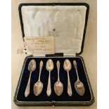 A set of 6 silver spoons in original case.