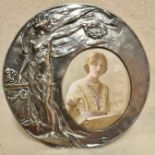 An Art Nouveau styled bronze picture frame with original Gladys Cooper picture