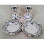 A pair of silver dishes, hallmarked for 1896, Birmingham, Eustace George Parker and a pair of silver