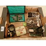 A box of collectables to include Singer accessories and welding goggles etc.