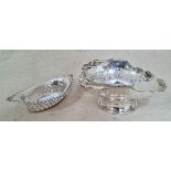 A silver footed bon-bon dish with pierced decoration and wavy handle, hallmarked for 1924,