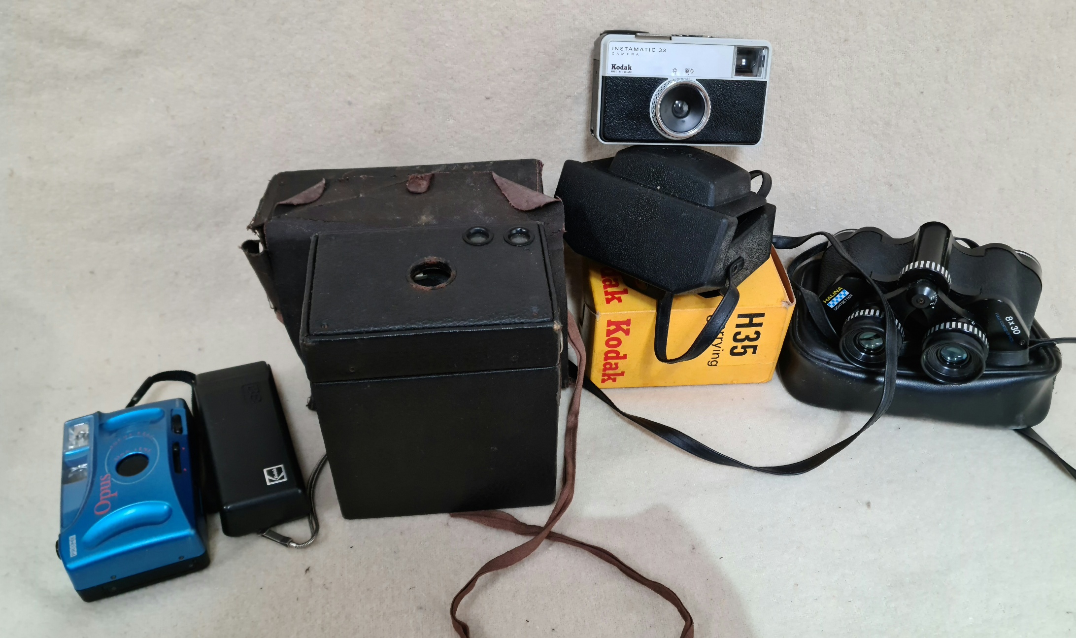 A collection of cameras to include an antique 1910 Kodak Eastman 116 box camera, a Kodak