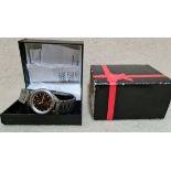 A Philip Persio quartz watch in original box, with instructions.