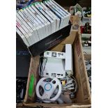 A box containing 3 Nintendo Wii's, accessories and a collection of games.