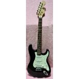 A Euro black strat copy electric guitar with soft case