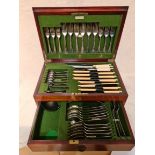 A mahogany canteen of silver plated cutlery.