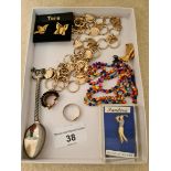 Quantity of costume jewellery to include a Pandora gold on silver pin badge.