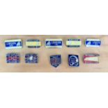 A group of 10 motorcycle pin badges