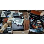 4 boxes of vintage cameras and accessories to include 35mm, cine cameras, developing equipment and
