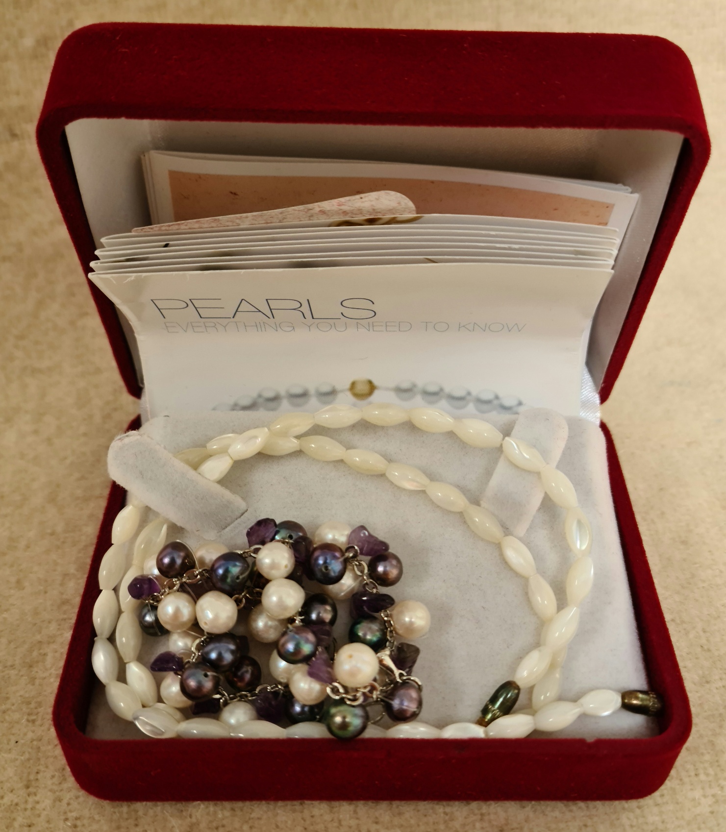 Cultured pearls bracelet and a MOP necklace.