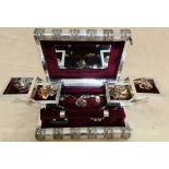 A white metal Indian style jewellery box in shape of 2 books, with cantilevered trays, rings support