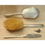 A pair of silver dressing table brushes, hallmarked for 1946, Birmingham by Albert Carter, a vintage